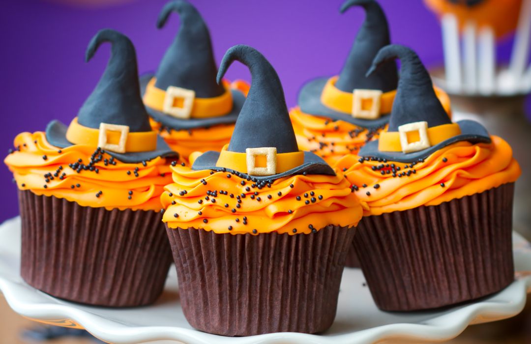 Holstein Housewares' Orange-Frosted Cupcakes with Whimsical Witch Hats Recipe